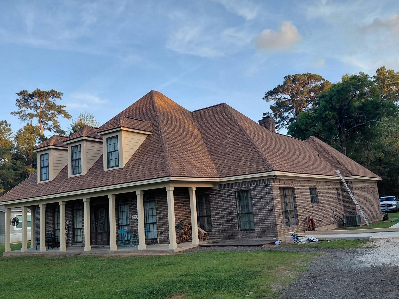 Completed roof replacement on a brick home in Cleveland, TX